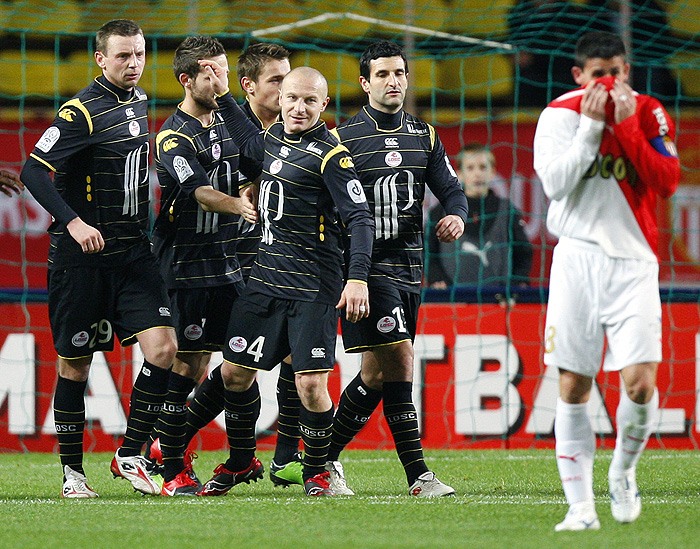 Lille's players celebrate after a goal during the French L1 football match Monaco vs Lille, on December 13, 2009 at the Louis II stadium in Monaco. Lille won 4-0. AFP PHOTO / VALERY HACHE