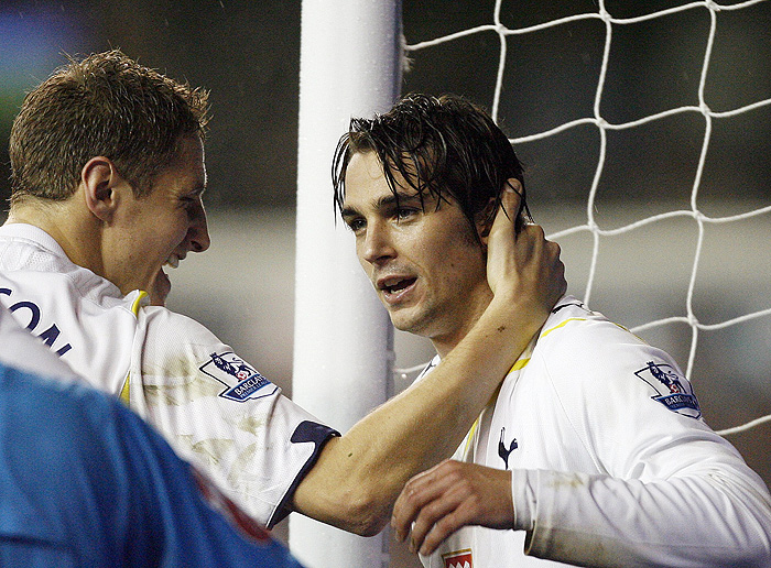Tottenham Hotspur's Croatian midfielder Niko Kranjcar (R) celebrates his second goal with English defender Michael Dawson (L) during their English Premier League football match against Manchester City at White Hart Lane, London, England, on December 16, 2009. AFP PHOTO/GLYN KIRKFOR EDITORIAL USE ONLY Additional licence required for any commercial/promotional use or use on TV or internet (except identical online version of newspaper) of Premier League/Football League photos. Tel DataCo +44 207 2981656. Do not alter/modify photo.
