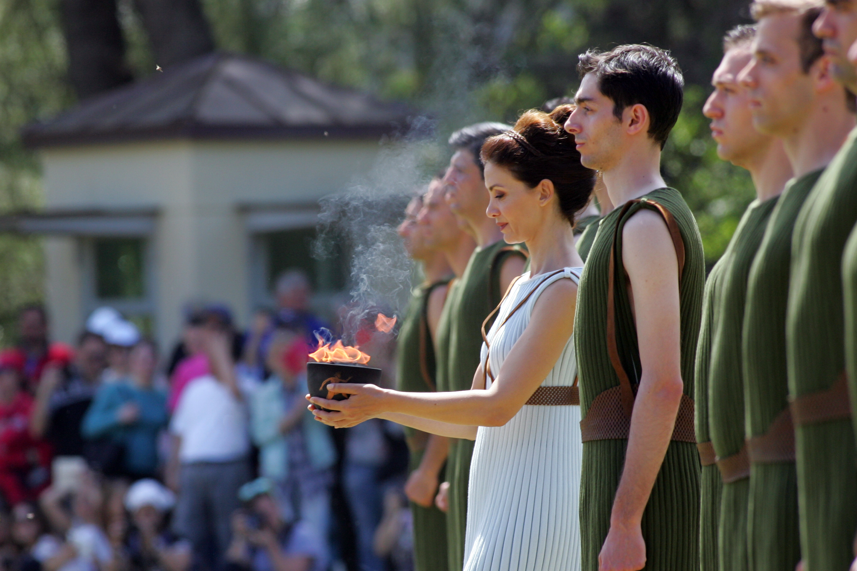 OLYMPIA, GREECE -  APRIL 20:  Actress Katerina Lechou acting the high pristess holds the Archaic Pot at the Ancient Stadium during the Rehearsal for the Lighting Ceremony of the Olympic Flame at Ancient Olympia on April 20, 2016 in Olympia, Greece.  (Photo by Milos Bicanski/Getty Images)