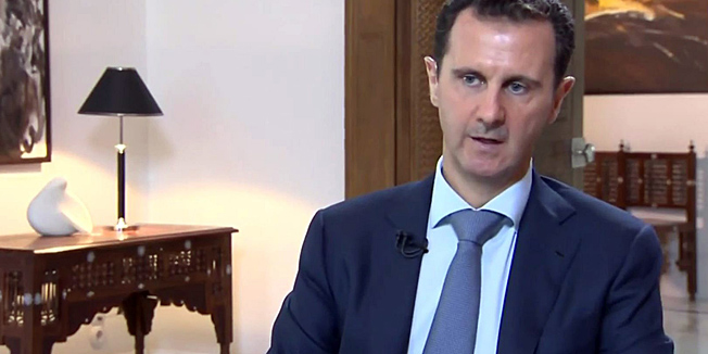 CORRECTING SOURCE An image grab taken from the Syrian Presidency on October 4, 2015 shows Syrian President Bashar al-Assad speaking during an interview in Damascus broadcast by Khabar TV, the news channel of the Islamic Republic of Iran Broadcasting (IRIB). Assad said that the success of Russia's military intervention in his country's civil war was vital for the whole Middle East. AFP PHOTO / HO / SYRIAN PRESIDENCY == RESTRICTED TO EDITORIAL USE - MANDATORY CREDIT 