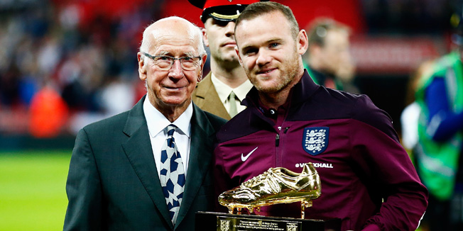 LONDON, ENGLAND - OCTOBER 09:  Wayne Rooney of England is presented with the Golden Boot by Sir Bobby Charlton after breaking his record of 49 goals prior to the UEFA EURO 2016 Group E qualifying match between England and Estonia at Wembley on October 9, 2015 in London, United Kingdom.  (Photo by Clive Rose/Getty Images)