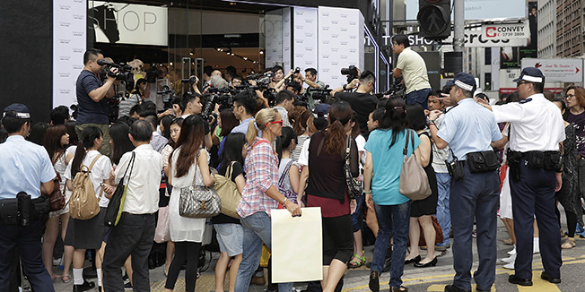 HONG KONG - JUNE 06: Media and shoppers crowd outside the new Topshop store in Hong Kong, just prior to the store being opened to the public, on June 6, 2013 in Hong Kong, Hong Kong.  (Photo by Jessica Hromas/Getty Images)