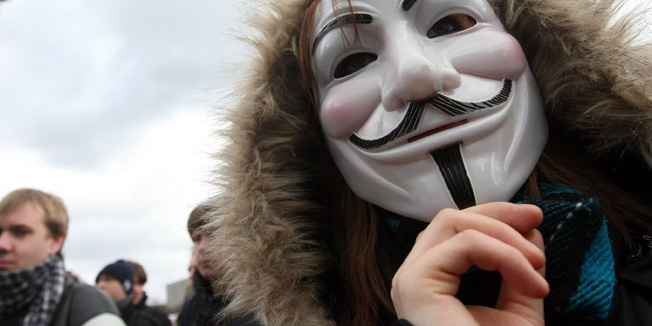 BERLIN, GERMANY - FEBRUARY 25:  An activist in a Guy Fawkes protests in front of the television tower (Fernsehturm) during a demonstration against the Anti-Counterfeiting Trade Agreement (ACTA) on February 25, 2012 in Berlin, Germany. ACTA is a proposed treaty attempting to establish an international governing body with legal standards intended to protect intellectual property and prevent the production and sale of counterfeit goods. The German government has delayed a decision on the agreement, citing concerns by the Justice Ministry, and according to news reports is waiting for approval by the European Parliament prior to signing the multinational treaty.  (Photo by Adam Berry/Getty Images)