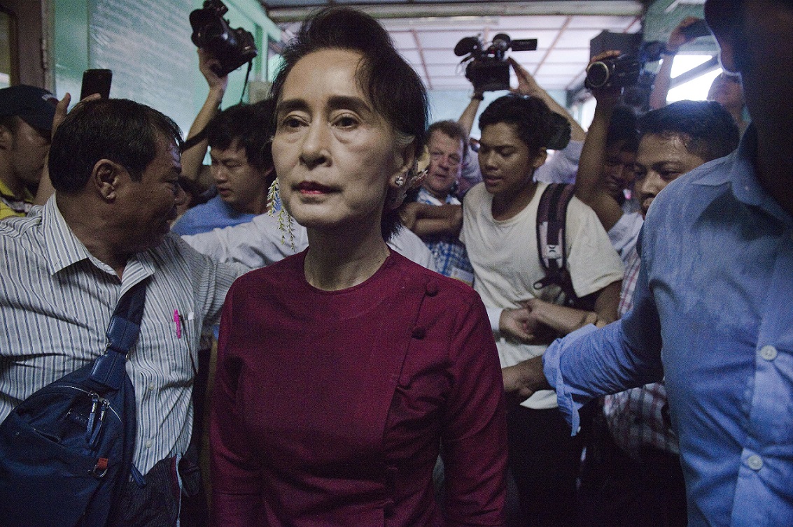 Myanmar opposition leader and head of the National League for Democracy (NLD) Aung San Suu Kyi leaves a polling station after casting her vote in Yangon on November 8, 2015. The historic poll could see Suu Kyi's opposition launched to power after decades of army rule. AFP PHOTO / Nicolas ASFOURI