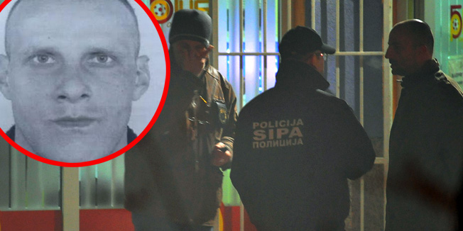 Bosnian policemen are seen while securing a crime scene during an investigation in Sarajevo's Northern suburb of Rajlovac  late on November 18, 2015, after an attack by an armed suspect. Two soldiers from the Bosnian army were shot dead when the gunman used an automatic weapon to shoot a  betting shop near army barracks. The gunman also shot at a bus when fleeing the area, injuring an additional three people.  AFP PHOTO/  ELVIS BARUKCIC