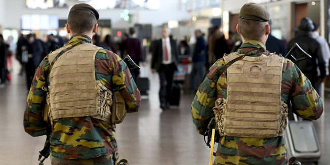 ***BELGIUM OUT***Military police soldiers patrol the Brussels Airport on November 18, 2015 in Zaventem, eastern Brussels. Belgium's national security level has been raised to three, following a series of coordinated attacks by Islamic State jihadists in Paris on November 13 that killed at least 129 people, including 3 Belgians, in scenes of carnage at a concert hall, restaurants and the national stadium, and connections following the attack between the terrorists and to Molenbeek, in west Brussels. AFP PHOTO / BELGA / DIRK WAEM