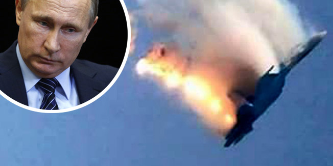 An image grab made from a video shows a burning Russian fighter jet coming down after being shot down near the Turkish-Syrian border, in Hatay on November 24, 2015. NATO member Turkey shot down a Russian fighter jet on the Syrian border today, threatening a major spike in tensions between two key protagonists in the four-year Syria civil war.  AFP PHOTO / IHLAS NEWS AGENCY ***TURKEY OUT***