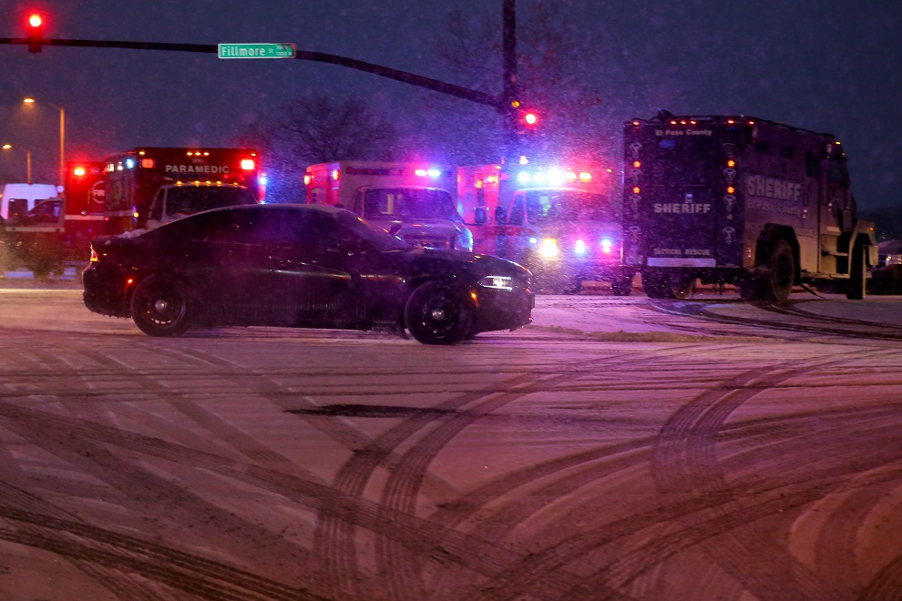 COLORADO SPRINGS, CO - NOVEMBER 27: A police vehicle carrying a suspect drives away from the scene during an active shooter situation outside a Planned Parenthood facility where an active shooter reportedly injured up to eleven people, including at least five police officers, on November 27, 2015 in Colorado Springs, Colorado. Police continue to investigate the scene and are searching the buiding for possible explosive devices.   Justin Edmonds/Getty Images/AFP== FOR NEWSPAPERS, INTERNET, TELCOS & TELEVISION USE ONLY ==