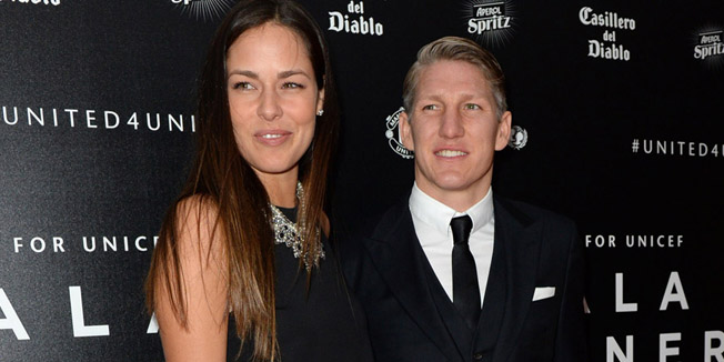 Manchester United's German midfielder Bastian Schweinsteiger (R) and his girlfriend, tennis player Ana Ivanovic pose for pictures on the red carpet as they arrive to attend the 