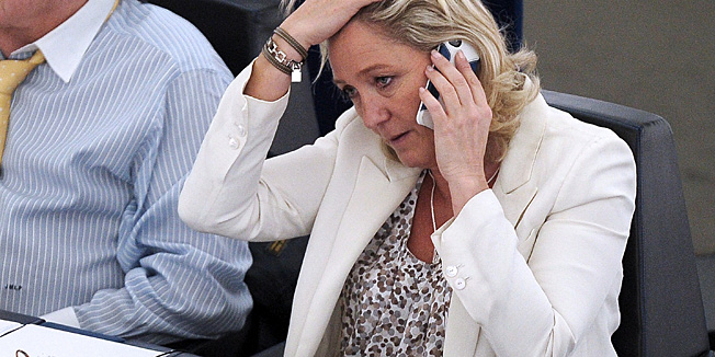 President of French far-right Front National (FN) party Marine Le Pen gestures during a session on the request for the waiver of her parliamentary immunity, at the European Parliament in Strasbourg, eastern France, on July 02, 2013.  AFP PHOTO/FREDERICK FLORIN
