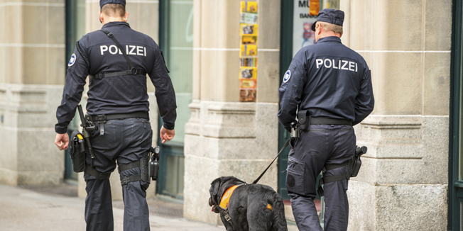 Policemen with dog on Zurich street, Switzerland