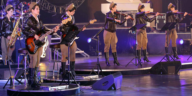 (FILES) This file photo released from North Korea's official Korean Central News Agency (KCNA) on April 20, 2014 and taken on April 16, 2014 shows an overview of the performance by the Moranbong Band in Pyongyang. North Korea's premier pop group, the all-girl Moranbong band formed by leader Kim Jong-Un, will electrify audiences in China in shows aimed at harmonising out-of-tune ties between the traditional allies, reports and the venue said on December 9, 2015 -- but tickets are not available to the public.           REPUBLIC OF KOREA OUT        AFP PHOTO / KCNA via KNS    THIS PICTURE WAS MADE AVAILABLE BY A THIRD PARTY. AFP CAN NOT INDEPENDENTLY VERIFY THE AUTHENTICITY, LOCATION, DATE AND CONTENT OF THIS IMAGE. THIS PHOTO IS DISTRIBUTED EXACTLY AS RECEIVED BY AFP. ---EDITORS NOTE--- RESTRICTED TO EDITORIAL USE - MANDATORY CREDIT 