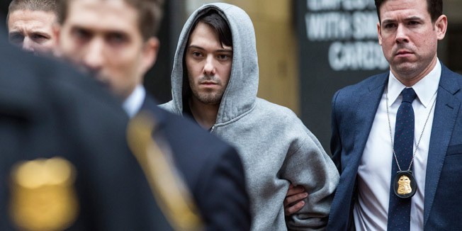 NEW YORK, NY - DECEMBER 17: Martin Shkreli (C), CEO of Turing Pharmaceutical, is brought out of 26 Federal Plaza by law enforcement officials after being arrested for securities fraud on December 17, 2015 in New York City. Shkreli gained notoriety earlier this year for raising the price of Daraprim, a medicine used to treat the parasitic condition of toxoplasmosis, from $13.50 to $750 though the arrest that happened early this morning does not involve that price hike.   Andrew Burton/Getty Images/AFP== FOR NEWSPAPERS, INTERNET, TELCOS & TELEVISION USE ONLY ==
