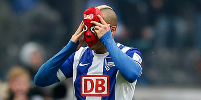 BERLIN, GERMANY - MARCH 14:  Aenis Ben-Hatira celebrates after scoring his teams first goal with a spider man masc during to the Bundesliga match between Hertha BSC and FC Schalke 04 at Olympiastadion on March 14, 2015 in Berlin, Germany.  (Photo by Boris Streubel/Bongarts/Getty Images)