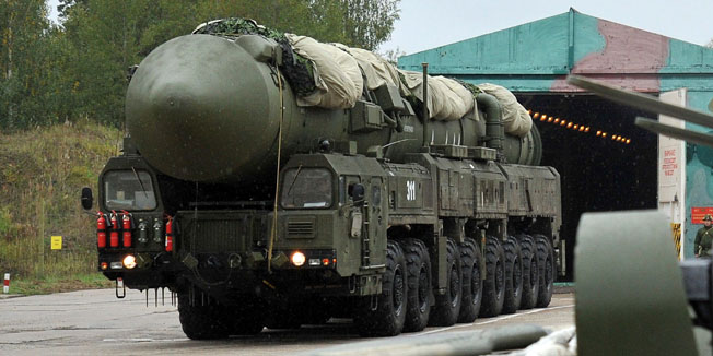 A Russian RS-24 Yars thermonuclear intercontinental ballistic missile launcher rolls out of the paint hangar at a strategic missile forces base near the town of Teykovo, some 200 km northeast of Moscow,  on September 22, 2011. Russian strategic missile forces started to replace the mobile version of the Topol-M intercontinental ballistic missiles with an advanced Yars model in 2009, the Russian media reported. AFP PHOTO / ANDREY SMIRNOV