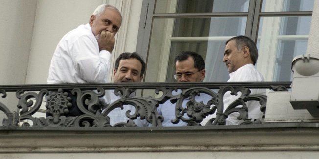 (From L) Iranian Foreign Minister Mohammad Javad Zarif, Iranian Deputy Foreign Minister Abbas Araqchi, Iran's deputy foreign minister for European and American Affairs, Majid Takht-Ravanchi, and Hossein Fereydoun, the brother of the Iranian president gather onto a balcony of the Palais Coburg Hotel, where the Iran nuclear talks meetings are being held in Vienna on July 11, 2015.  World powers struggled on July 11  to break a deadlock in marathon negotiations with Iran, as they seek a deal curbing Tehran's nuclear ambitions in return for sanctions relief. AFP PHOTO / JOE KLAMAR