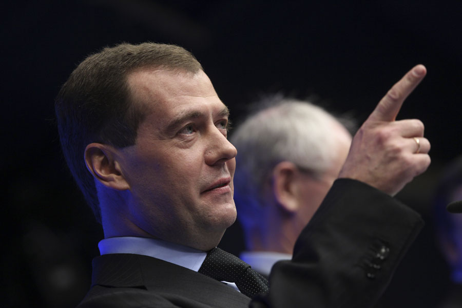 Russia's President Dmitry Medvedev points his finger as he addresses the media at the European Council building in Brussels for the twice-yearly EU-Russia meeting, Thursday, Dec. 15, 2011. Russia, hoping to keep its largest export market from collapsing, will give at least $10 billion to the International Monetary Fund to help support the struggling euro currency, an aide to President Dmitry Medvedev said Thursday.(AP Photo/Yves Logghe)