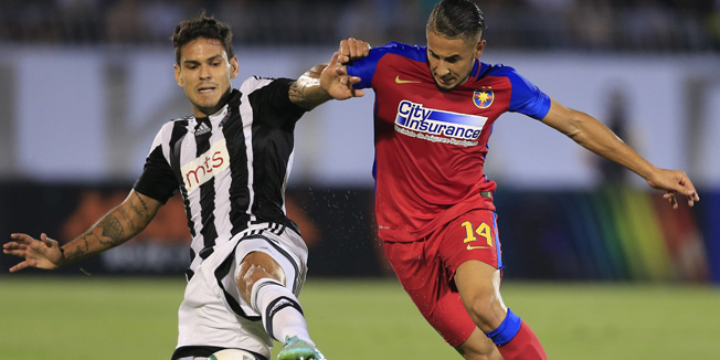 BELGRADE, SERBIA - AUGUST 05: Jugurtha Hamroun (R) of FC Steaua Bucharest in action against Fabricio (L) of FC Partizan Belgrade during the UEFA Champions League Third Qualifying Round Second Leg match between FC Partizan Belgrade and FC Steaua Bucharest at FC Partizan stadium in Belgrade, Serbia on Wednesday, August 05, 2015. (Photo by Srdjan Stevanovic/Getty Images)