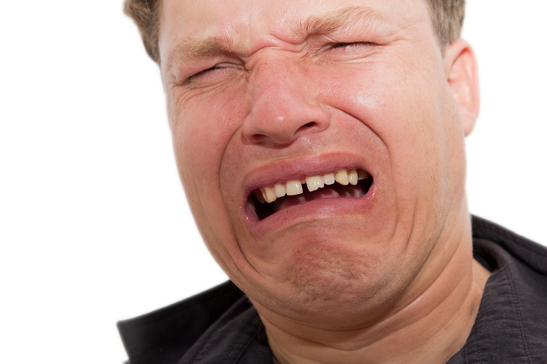 man crying on a white background