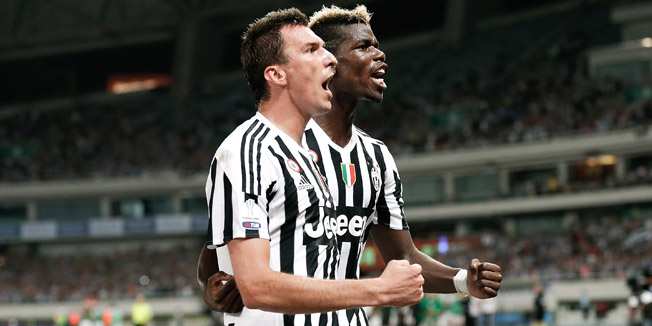 SHANGHAI, CHINA - AUGUST 08:  Mario Mandzukic celebrates a goal with his teammate Paul Labile Pogba of Juventus FC during the Italian Super Cup final football match between Juventus and Lazio at Shanghai Stadium on August 8, 2015 in Shanghai, China.  (Photo by Lintao Zhang/Getty Images)