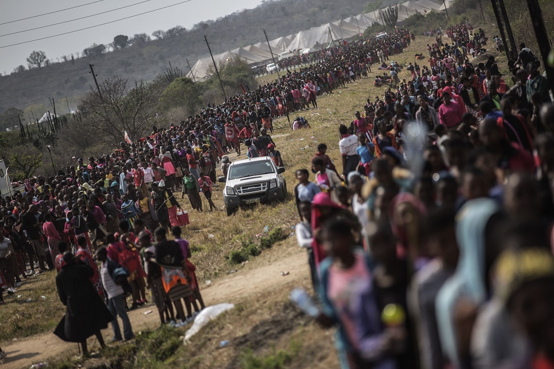 Tens of thousands of Swaziland girls dance and sing as they get ready to walk to the Royal palace two days ahead of the traditional Reed Dance, on August 28, 2015 on a farm on the outskirts of Luve, in Swaziland. Umhlanga, or the Reed Dance ceremony, is an annual Swazi cultural event where tens of thousands of Swazi girls travel from the various chiefdoms to the Ludzidzini Royal Village to participate in the eight-day event.   AFP PHOTO/GIANLUIGI GUERCIA