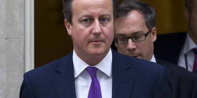 British Prime Minister David Cameron leaves 10 Downing Street in central London on 26 September, 2014. Britain geared up for renewed military action in Iraq with lawmakers expected to vote in favour of joining air strikes against Islamic State (IS) militants Friday despite echoes of the unpopular US-led 2003 invasion under Tony Blair. Prime Minister David Cameron will kick off the debate at the House of Commons from 0930 GMT and has argued that Britain should not be 