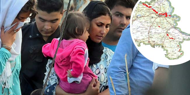 Migrants of different countries are diverted by Hungarian police officials ahead to the next point at the border between Hungary and Serbia near the village of Roszke on September 14, 2015 as the opened fence area of the line is closed by Hungarian police. Hungary has stopped registering thousands of migrants crossing the border from Serbia and transport them straight to the Austrian frontier. AFP PHOTO / ATTILA KISBENEDEK