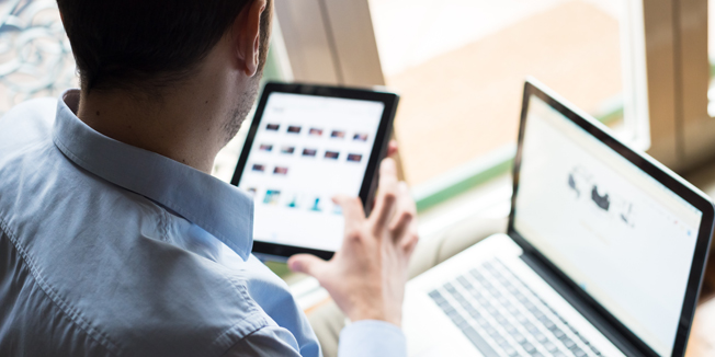 elegant business multitasking multimedia man using devices at home