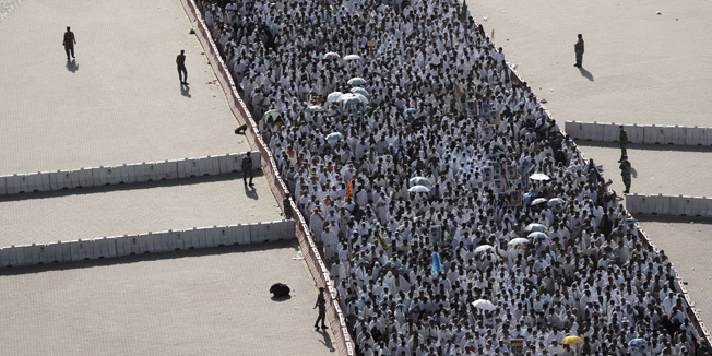 (FILES) - A file picture taken on October 4, 2014 shows Muslim pilgrims arriving to throw pebbles at pillars during the 