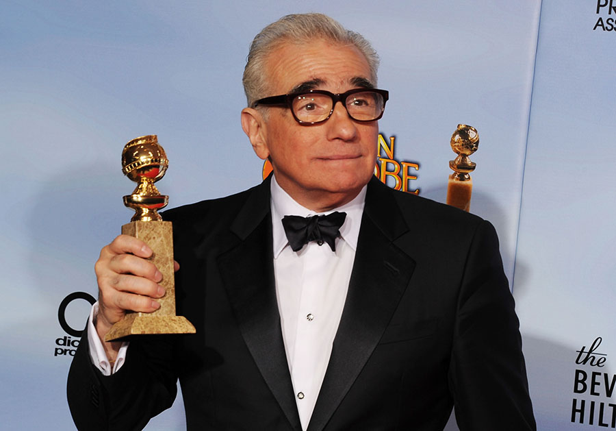 Director Martin Scorsese poses in the press room with the Best Director for a Motion Picture award for 