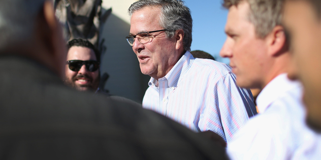 MIAMI, FL - DECEMBER 17: Former Florida Governor Jeb Bush hands out items for Holiday Food Baskets to those in need outside the Little Havana offices of CAMACOL, the Latin American Chamber of Commerce on December 17, 2014 in Miami, Florida. Mr. Bush spoke to the media as he handed out food to the annoucement that the United States and Cuba worked out a deal for the release of USAID subcontractor Alan Gross.   Joe Raedle/Getty Images/AFP== FOR NEWSPAPERS, INTERNET, TELCOS & TELEVISION USE ONLY ==