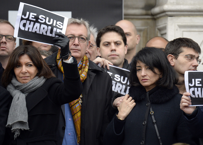Paris city councilors and relatives pose on January 9, 2013 outside the Paris City Hall with 