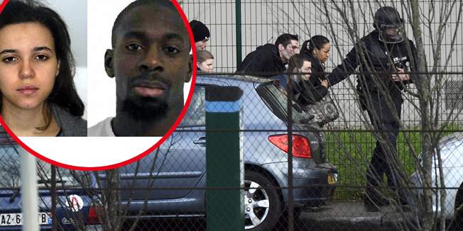 TOPSHOTSFrench police special forces evacuate local residents on January 9, 2015 in Saint-Mande, near Porte de Vincennes, eastern Paris, after at least one person was injured when a gunman opened fire at a kosher grocery store on January 9, 2015 and took at least five people hostage, sources told AFP. The attacker was suspected of being the same gunman who killed a policewoman in a shooting in Montrouge in southern Paris on January 8.   AFP PHOTO / MARTIN BUREAU