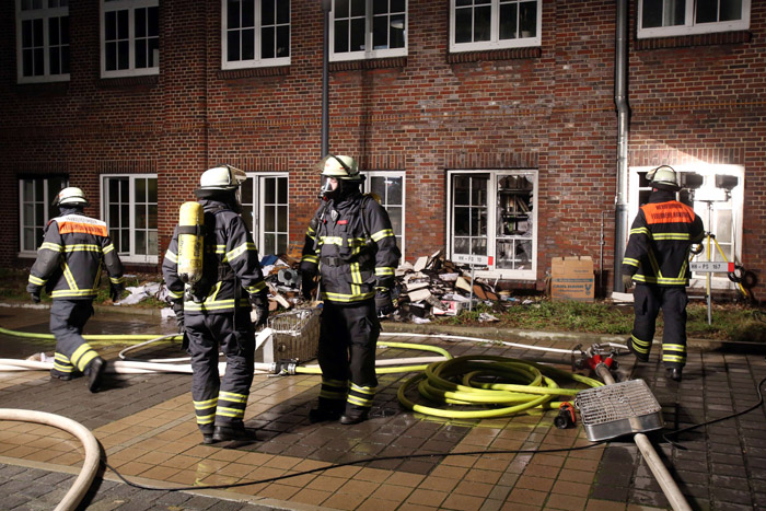 Fireworkers gather in the courtyard of German regional newspaper Hamburger Morgenpost editorial office in Hamburg, northern Germany, on January 11, 2015 after an arson attack. The paper that reprinted Mohammed cartoons from the French satirical paper Charlie Hebdo was the target of an arson attack with rocks and a burning object early Sunday January 11, 2015, but no one was hurt, police said.  AFP PHOTO / DPA / BODO MARKS +++ GERMANY OUT