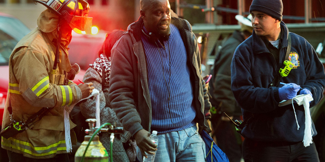 Washington, DC, firefighters assist a man(C) and set up mass casuality procedures after passengers on the Washington METRO (subway) service January 12, 2015, were injured when smoke filled the L'Efant Plaza station during the rush hours.  The L'Enfant Plaza metro station in downtown Washington was temporarily closed on Monday after a fire filled the station with smoke, the Washington Metropolitan Travel Authority said in a release. Metro Transit Police and fire department personnel were at the station examining the problem, WMATA said, but had not yet found the source of the problem.     AFP PHOTO/PAUL J. RICHARDS