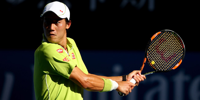 MELBOURNE, AUSTRALIA - JANUARY 26:  Kei Nishikori of Japan plays a backhand in his fourth round match against David Ferrer of Spain during day eight of the 2015 Australian Open at Melbourne Park on January 26, 2015 in Melbourne, Australia.  (Photo by Clive Brunskill/Getty Images)