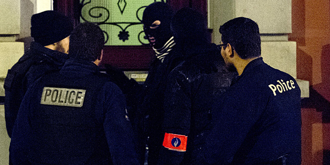 Police officers work in a cordoned off section of Colline street in Verviers, eastern Belgium, on January 15, 2015, after two suspected jihadists were killed during an anti-terrorist operation. Belgian police shot dead two suspects in a huge operation against jihadists who had returned from Syria and planned an imminent attack, a new horror for Europe just days after the Paris massacre. Prosecutors said a third suspect was injured after heavily-armed militants with Kalashnikov assault rifles opened fire on police carrying out a raid on a property in Verviers, eastern Belgium. AFP PHOTO / ANP / MARCEL VAN HOORN --NETHERLANDS OUT--