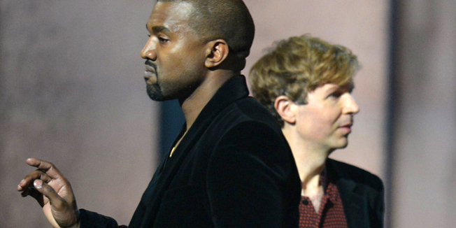 (FILES) In this February 8, 2015 file photo, winner for Album Of The Year Beck reacts as Kanye West appears on stage at the 57th Annual Grammy Awards in Los Angeles February 8, 2015. West on February 11, 2015 urged an overhaul of the Grammys to award commercially successful musicians, even as the rapper toned down his criticism of this year's surprise winner Beck. The famously mercurial West stole the spotlight at the music industry's awards night Sunday when he rushed toward the stage as Beck -- the innovative rocker who has enjoyed critical acclaim, if a niche following, for two decades --accepted the Album of the Year award for his lush, melancholy 