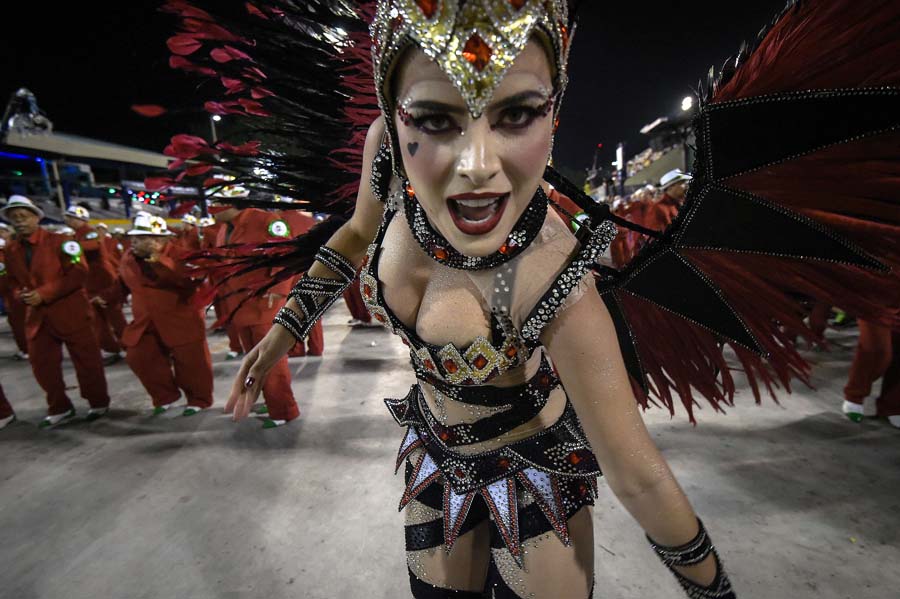 Revelers of the Grande Rio samba school perform during the first day of carnival parade at the Sambodrome in Rio de Janeiro, Brazil on February 16, 2015. AFP PHOTO/YASUYOSHI CHIBA