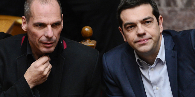 Greek Prime Minister Alexis Tsipras (R) and Finance Minister Yianis Varoufakis sit during the vote for  president at the Greek parliament in Athens on February 18, 2015.  Finance Minister Yanis Varoufakis said Wednesday Athens' formal request for a loan extension from the EU would meet the demands of both the Greeks and the Eurogroup, and he was optimistic a deal could be reached. AFP PHOTO / LOUISA GOULIAMAKI