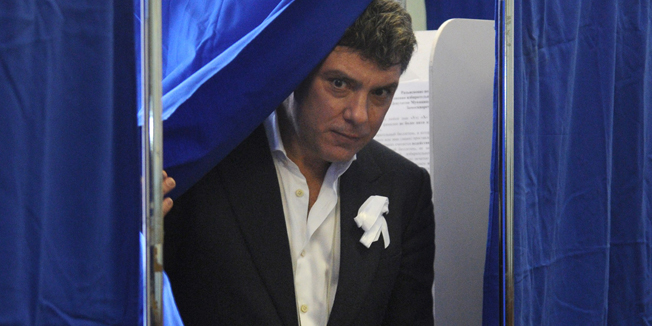 (FILES) - A picture taken on Marc 4, 2012 shows opposition leader, former first deputy prime minister Boris Nemtsov, leaving a voting booth after marking his ballot as part of presidential elections in a polling station in Moscow. Boris Nemtsov was shot dead in Moscow on February 27, 2015, according to Russian officials. AFP PHOTO / ANDREY SMIRNOV