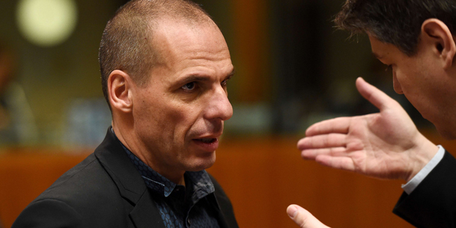 Greece's Finance Minister Yanis Varoufakis (L) speaks with Croatia's Finance Minister Boris Lalovac during an economic and financial affairs council (ECOFIN) at the European Council in Brussels, March 10, 2015. AFP PHOTO / EMMANUEL DUNAND
