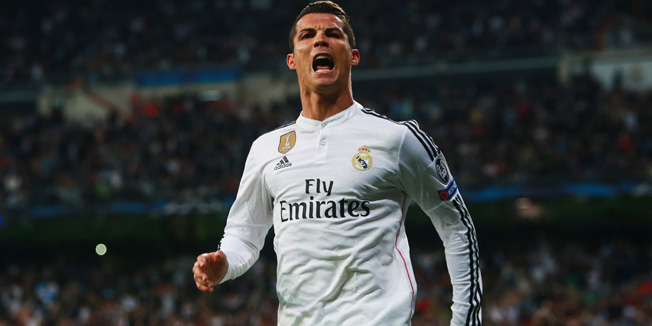 MADRID, SPAIN - MARCH 10:  Cristiano Ronaldo of Real Madrid CF celebrates as he scores their second goal during the UEFA Champions League Round of 16 second leg match between Real Madrid CF and FC Schalke 04  at Estadio Bernabeu on March 10, 2015 in Madrid, Spain.  (Photo by Alex Grimm/Bongarts/Getty Images)