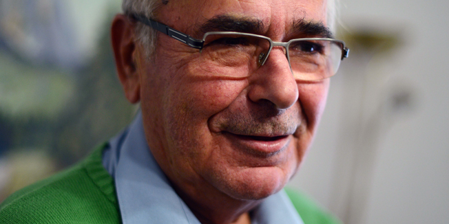 TO GO WITH AFP STORY BY YANNICK PASQUET - Harald Jaeger, a retired Lieutenant Colonel in the former east German secret police Stasi, poses in his home in Werneuchen, north of Berlin on November 4, 2014. Jaeger is credited with opening up the Bornholmer Strasse border crossing on 9 November 1989 to let thousands of east German citizens cross into west Berlin, thus opening up the Berlin Wall. AFP PHOTO / JOHN MACDOUGALL