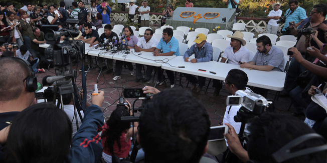 Teachers, students and relatives of the 43 missing students offer a press conference at Ayotzinapa school in Tixtla, Guerrero state, Mexico, on November 7, 2014. Suspected gang members in Mexico confessed to killing more than 40 missing students and incinerating their remains in a grisly case that shocked the country and triggered angry protests, authorities said Friday. Facing the biggest crisis of his administration, President Enrique Pena Nieto vowed to hunt down all those responsible for the 