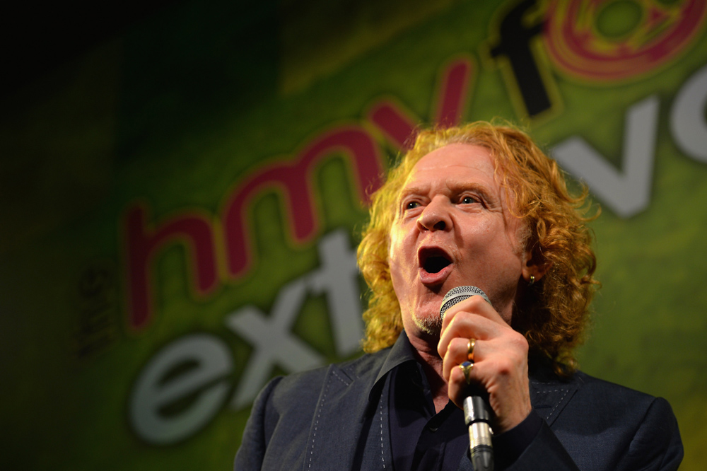LONDON, ENGLAND - OCTOBER 29:  Singer Mick Hucknall performs on stage during the Football Extravaganza at the Grosvenor House Hotel on October 29, 2013 in London, England.  (Photo by Christopher Lee/Getty Images)