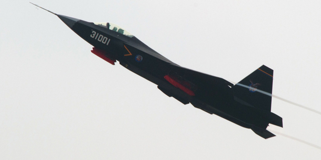  A Chinese J-31 stealth fighter performs at the Airshow China 2014 in Zhuhai, south China's Guangdong province on November 11, 2014. Global aviation firms flocked to China on November 11 to show off their wares as economic development and an expanding middle class promise a bonanza in one of the world's fastest-growing aircraft markets.  AFP PHOTO / JOHANNES EISELE