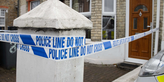 Police tape marks off the front of a residential address in High Wycombe, Buckinghamshire, north west of London, on November 8, 2014, in connection with the arrest of four anti-terror suspects. Police in London said on November 7 they had arrested four men in connection with an alleged Islamist plot, which media reports said was planned for British soil. Three suspects were detained in west London and one in High Wycombe, north west of the capital.  AFP PHOTO / LEON NEAL