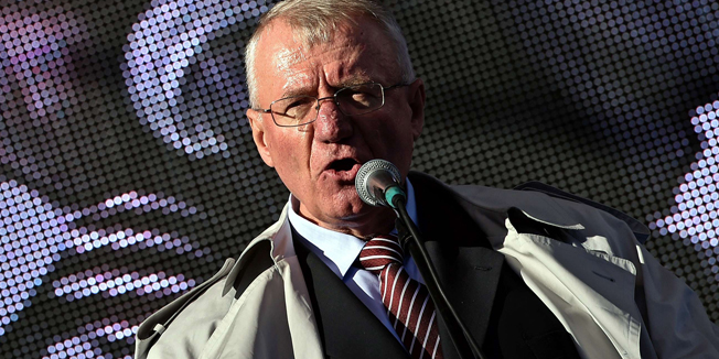 Serbian nationalist politician Vojislav Seselj addresses supporters during an anti-government rally in Belgrade on November 15, 2014. Seselj is spearheading an anti-government rally but as he fights cancer and awaits judgement on war crimes charges, he is as beleaguered as his once formidable party. AFP PHOTO / ANDREJ ISAKOVIC
