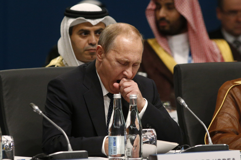 Russian President Vladimir Putin (C) yawns at the start of the plenary session at the G20 Summit in Brisbane on November 15, 2014. Australia is hosting the leaders of the world's 20 biggest economies for the G20 summit in Brisbane on November 15 and 16. AFP PHOTO / POOL / Kevin Lamarque